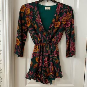 Everly size Small green floral romper. Bell sleeves and ruffle legs.  NWOT